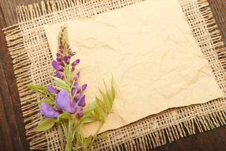 Wisteria flowers on a wooden background on sackingの写真素材