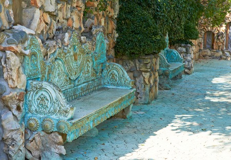 antique wooden bench with copper decorative sidesの写真素材