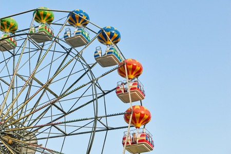 GOLDEN SANDS, BULGARIA - June 06, 2017: Large beautiful Ferris wheel with tourists on the pedestrian promenade in Golden Sands, Bulgariaのeditorial素材