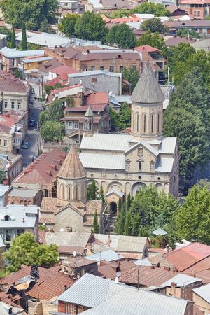 TBILISI, GEORGIA - AUGUST 3, 2013: Top view of the old quarter of the city of Tbilisi, Georgia. Many...