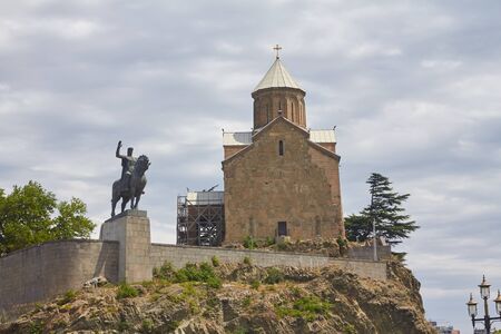 TBILISI, GEORGIA - AUGUST 3, 2013: Metekhi Church of Assumption and Vakhtang Gorgasali monumen on...