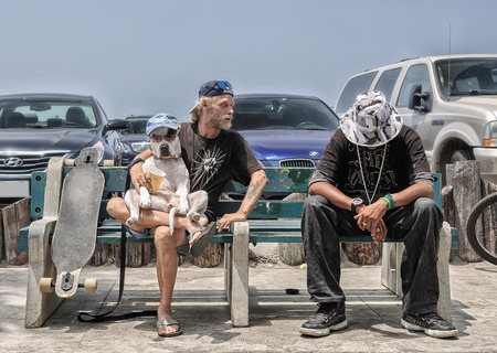 VENICE BEACH LOS ANGELES CIRCA JUNE 2014: Two friends open dog show on the coast Venice Beach circa June 2014 in Los Angeles Californiaのeditorial素材