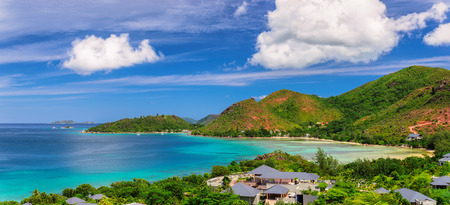 Paradise beach on tropical island Praslin at sunset in Seychelles