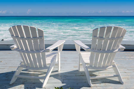 Beach chairs on Cape Cod beach at sunset, Cape Cod, Massachusetts, USA.の写真素材