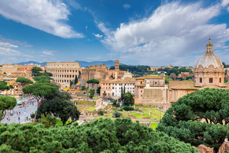 Rome skyline at sunny day. Ariel view of Roman forum and Colosseum in Rome, Italy.