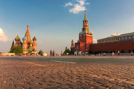 Red square in Moscow at sunset with Kremlin Wall and St Basil Cathedral. Moscow Russia.の写真素材