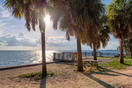 Picnic area and pier on the beach at sunset in Key Biscayneの写真素材