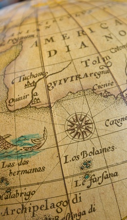 Closeup compass in vintage globeの写真素材