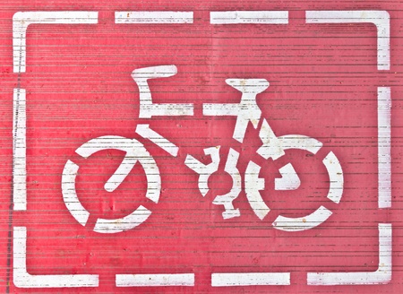 white bicycle sign in frame on red background