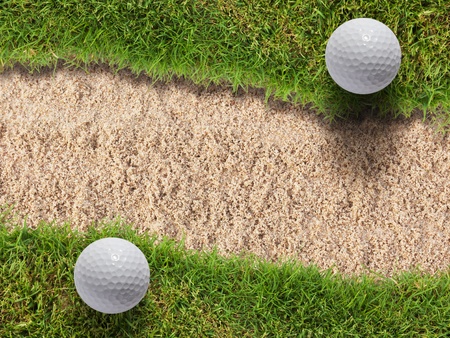 Two golf ball on green grass near sand bunkerのeditorial素材