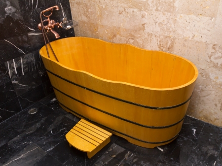 Wooden bathtub in a bathroom