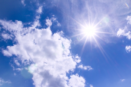 Sun and clouds in Blue skyの写真素材