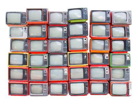 Many old vintage televisions pile up isolated on white background with clipping pathの写真素材