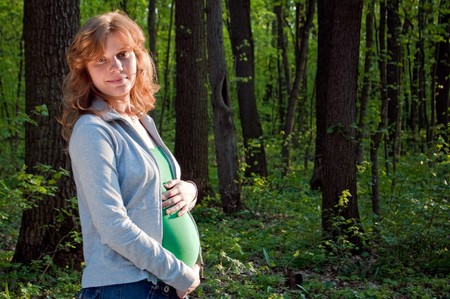 Happy young pregnant woman