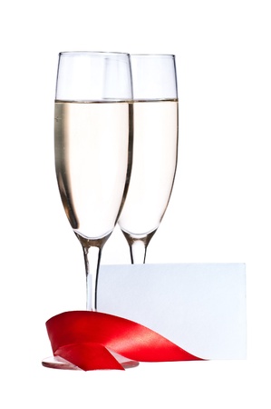 Glasses with Champagne and blank invitation cardの写真素材