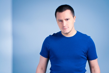 Portrait of an adult man with a smirk faceの写真素材