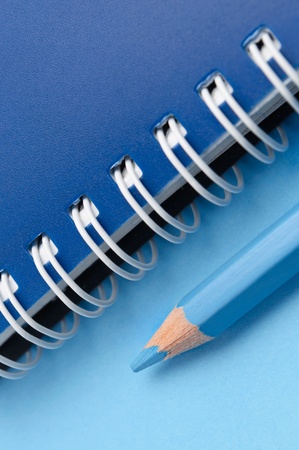 Blue pencil and spiral of notebook - macroの写真素材