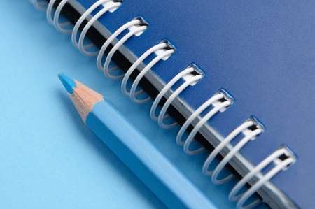 Blue pencil and spiral of notebook - macroの写真素材