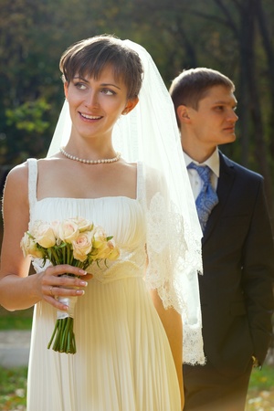Beautiful Bride and groom together in parkの写真素材