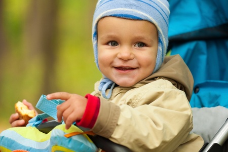 Portrait of little baby boy in the park