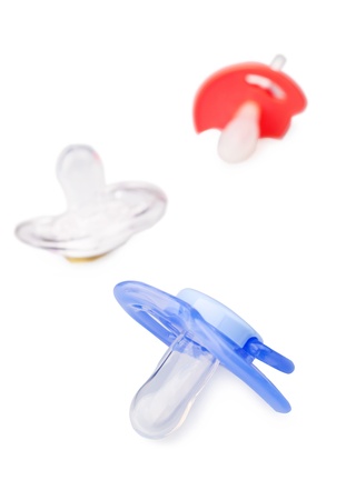 Different Baby dummies isolated over whiteの写真素材