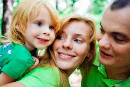 Portrait of a funny family having good time outdoorsの写真素材