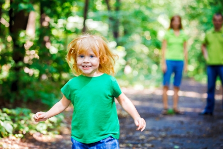 Portrait of Happy Little Girl with Familyの写真素材