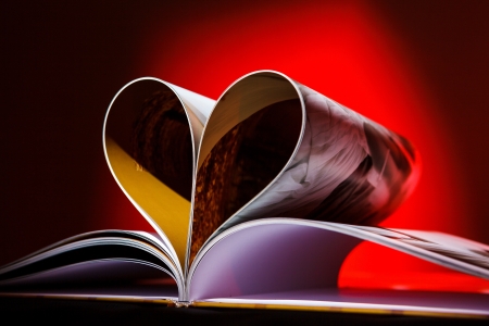 Pages of book curved into a heart shapeの写真素材