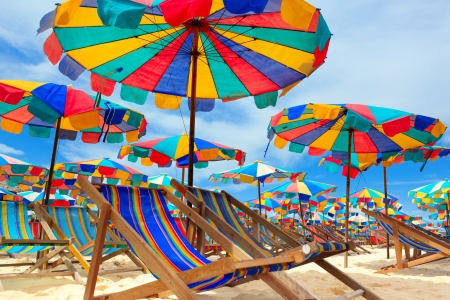 Beach chair and umbrellas on the beach - Kay Island, Thailandの写真素材