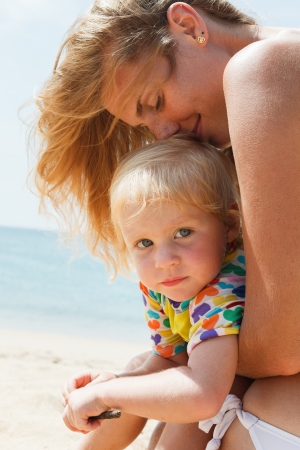 Mother With Little Nice Daughter on beachの写真素材