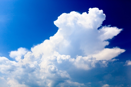 Blue clear sky with a white cloud - close upの写真素材