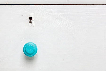 Closeup of an old door wardrobe knob and key hole. Empty space for text.の写真素材