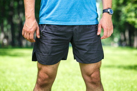 Closeup of a male runner standing - space for text. Fitness concept.の写真素材