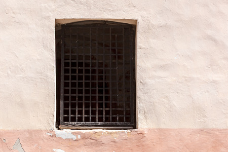 Window with lattice in old wall.