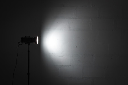 Professional photo studio strobe with reflector on tripod.の写真素材