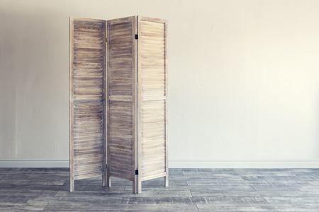 Wooden folding screen on white background. Vintage effect.の写真素材