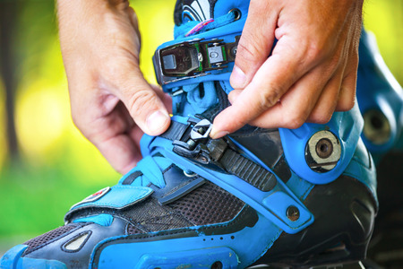Close up photo of roller adjusting buckle on inline roller skates.