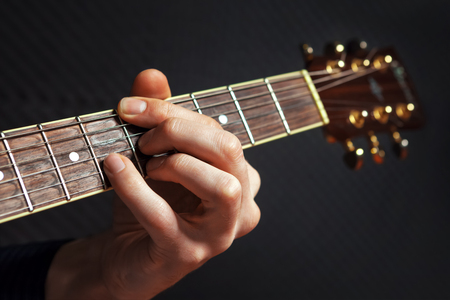 Closeup of guitarist hand practicing with chords.の写真素材