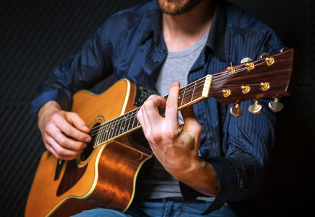 Rock guitarist practicing in sound studio.の写真素材