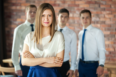 Group of young business people standing and looking at camera.の写真素材