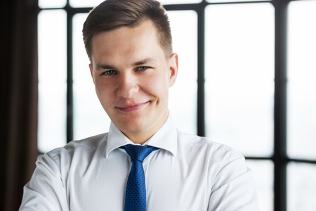 Portrait of confident young business man looking at camera.の写真素材