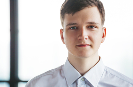 Portrait of young employee looking at camera.の写真素材