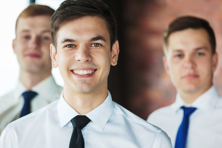 Group of young business people standing and looking at camera.の写真素材