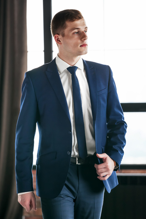 Portrait of fashionable handsome business man posing.の写真素材