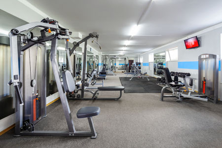 Modern gym interior with sports equipment.の写真素材