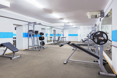 Modern gym interior with sports equipment.の写真素材