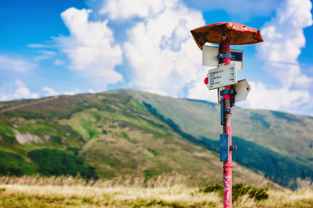 Metal trail post on the road in the Carpathian mountains, Ukraine.の写真素材