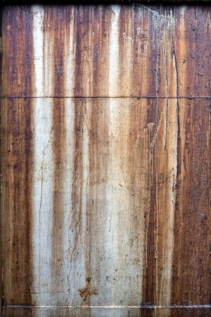 Close up of grungy metal painted panel with leaking oil.の写真素材