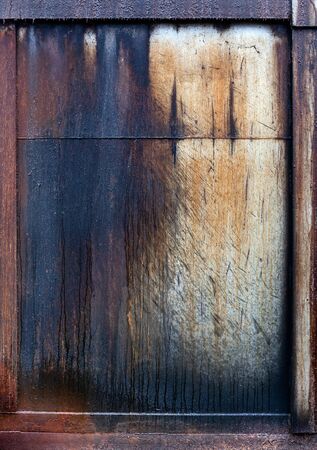 Close up of grungy metal painted panel with leaking oil.の写真素材