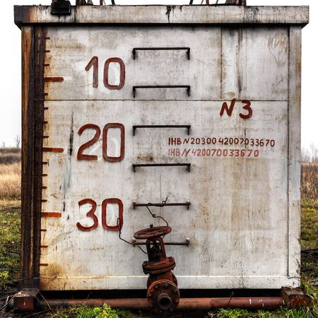 Side view of old weathered technical building with depth marks.の写真素材